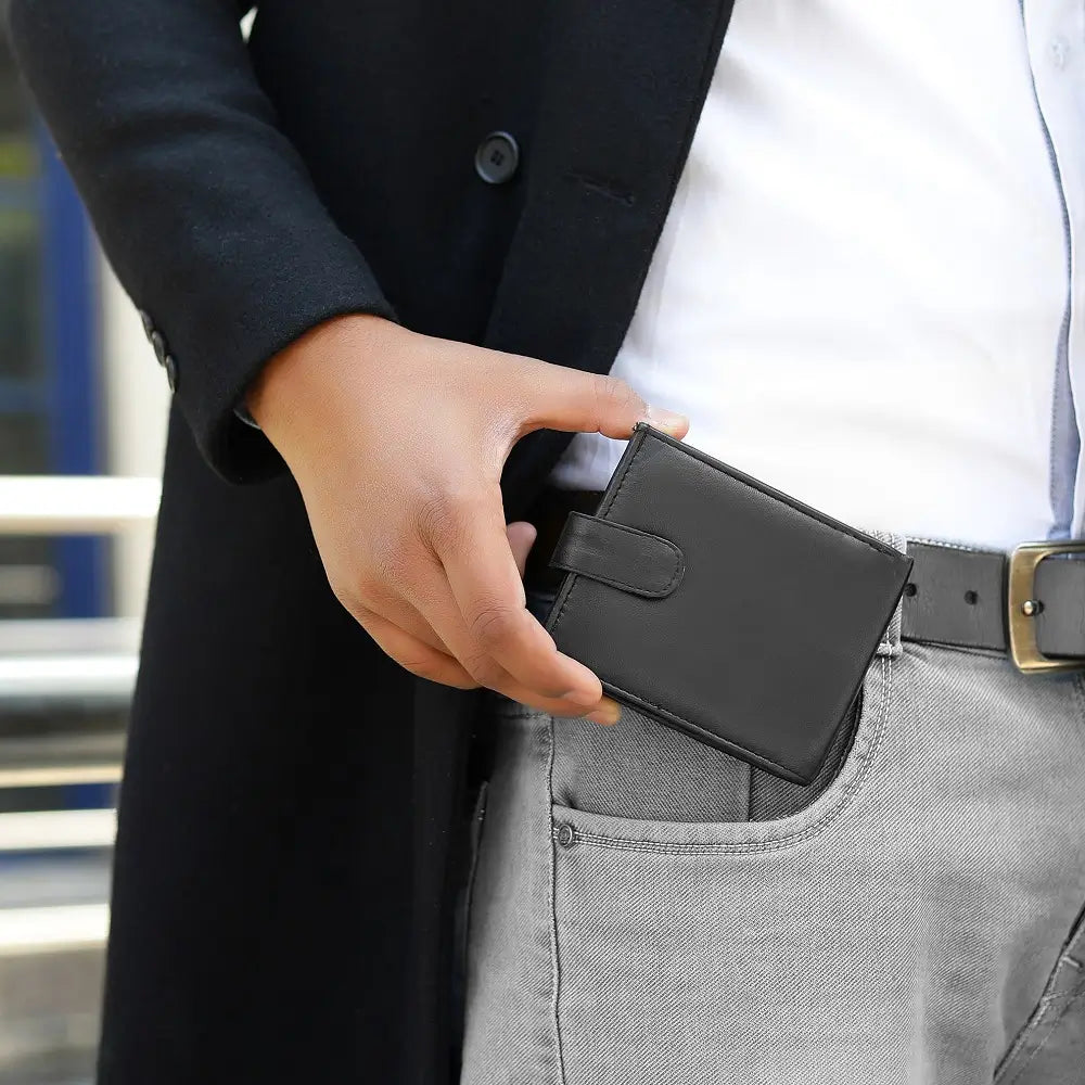 Person holding Basic Wallet Style 59 – RFID safe leather trifold wallet with tab closure