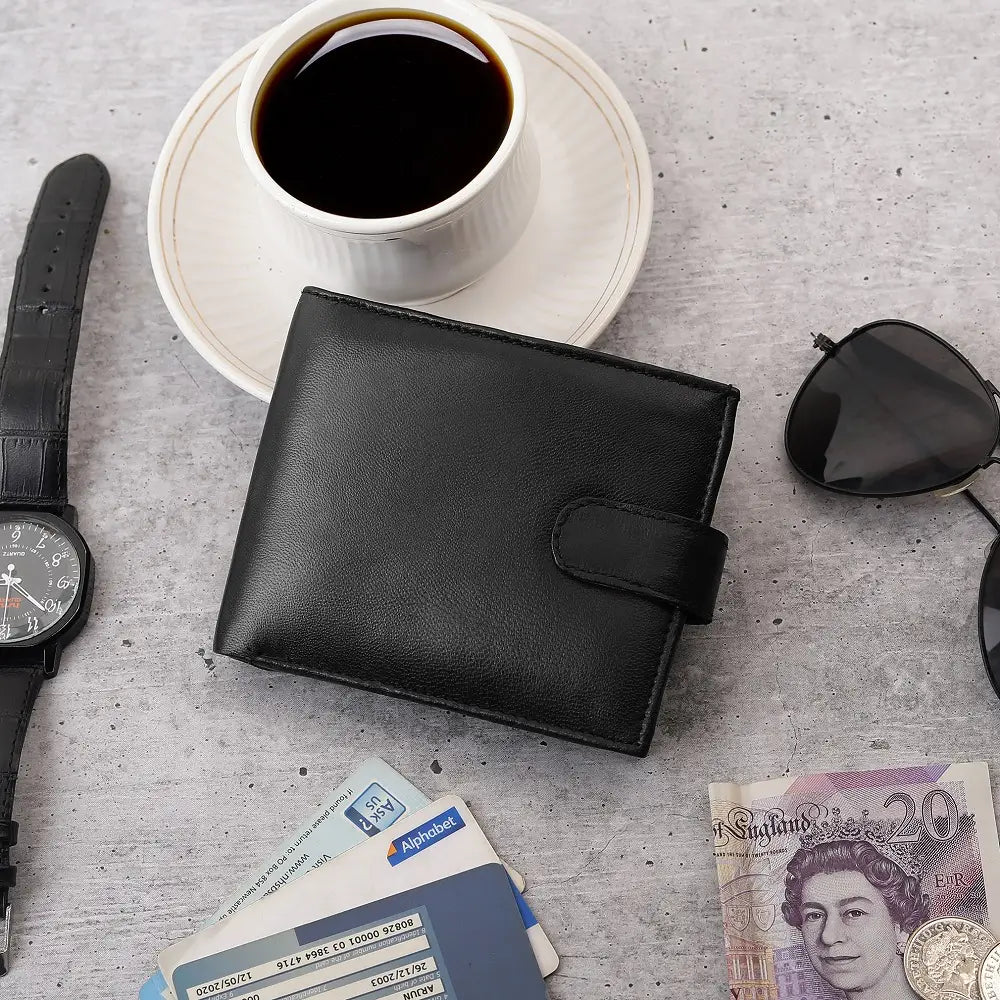 Flat lay of Basic Wallet Style 64 – bifold RFID leather wallet with cards, watch, coins, and glasses