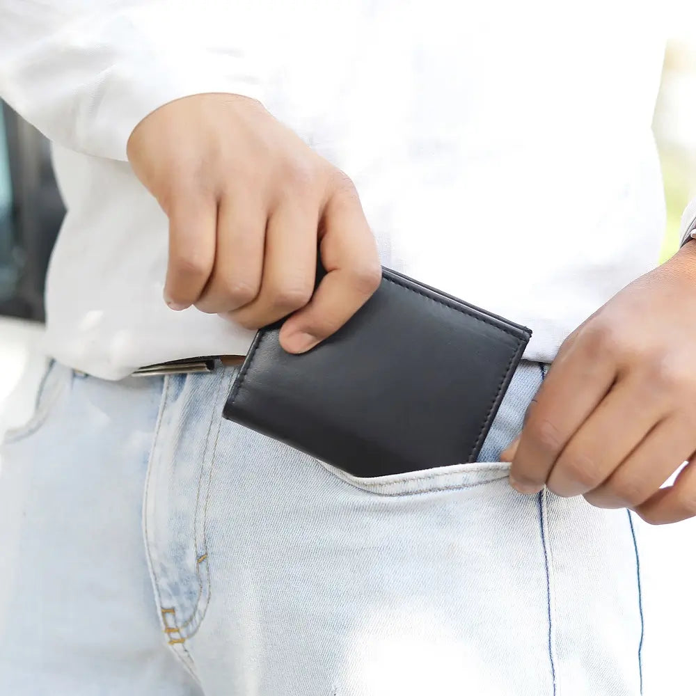 Person holding Basic Wallet Style 87 in black – genuine leather RFID bifold wallet