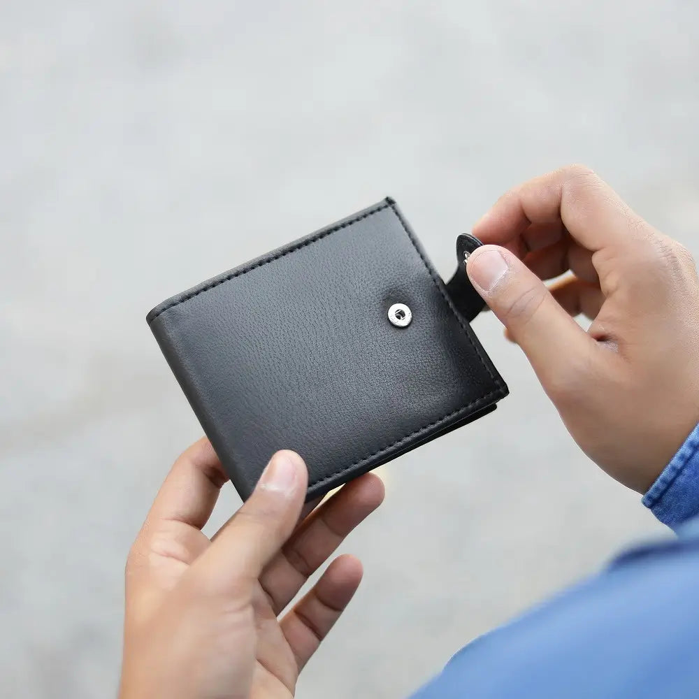 Person holding Basic Wallet Style 94 – RFID leather bifold wallet with zip coin pocket