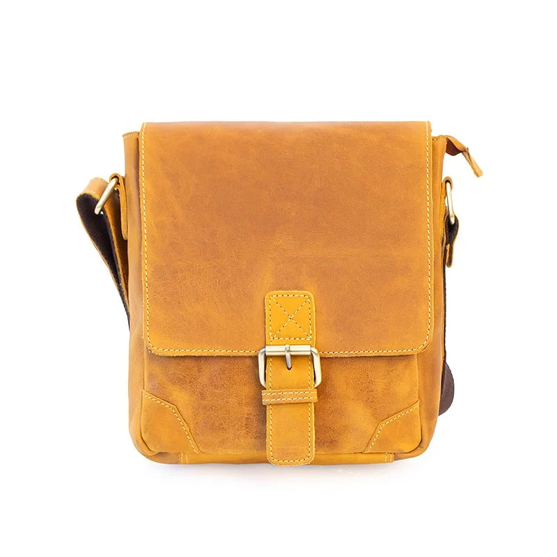 wholesale leather messenger bag in a mustard yellow colour. the bag is genuine leather with a front buckle and detailed stitching
