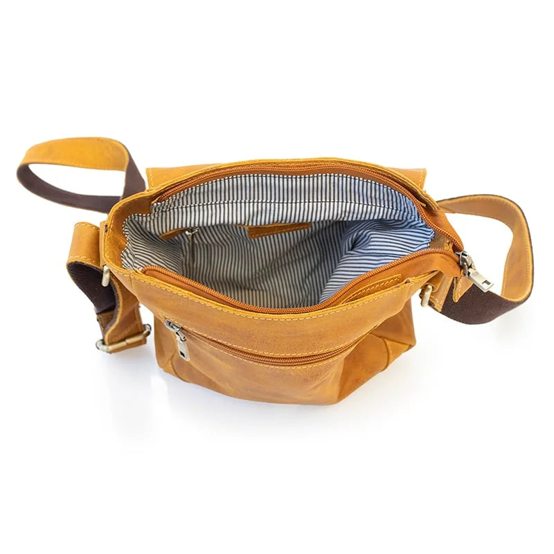 wholesale leather messenger bag in a mustard yellow colour. the bag is genuine leather with a front buckle and detailed stitching