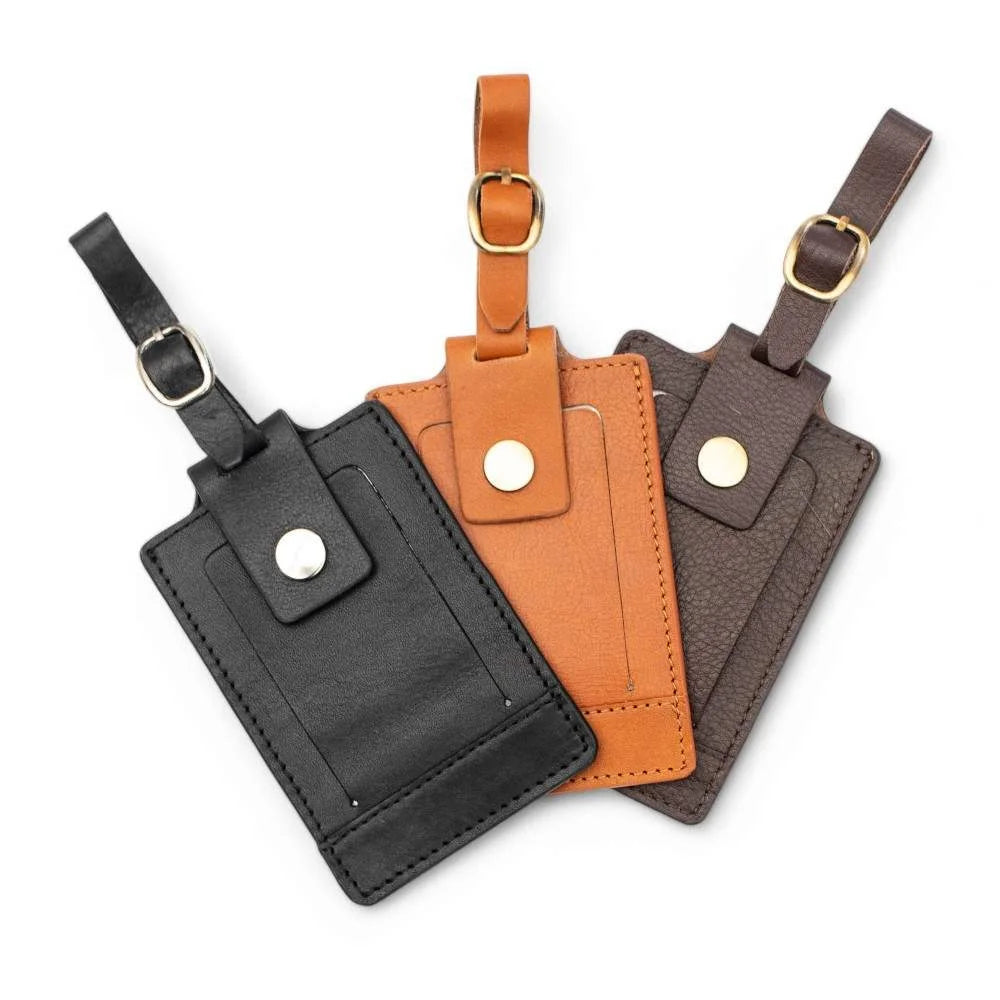 Overlapping leather luggage tags in black, tan, and brown with gold-tone buckles – SKU 901.