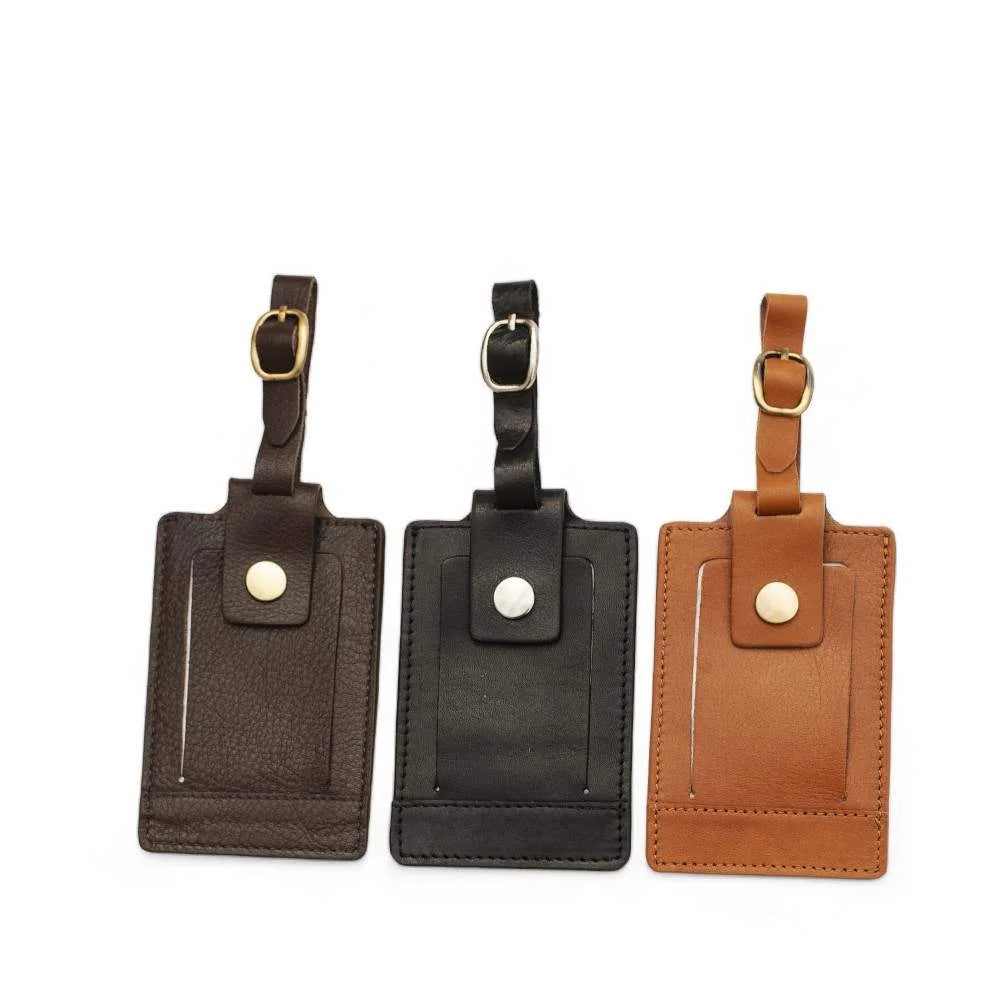 Three leather luggage tags in brown, black, and tan with buckle straps and snap-button closures – SKU 901.