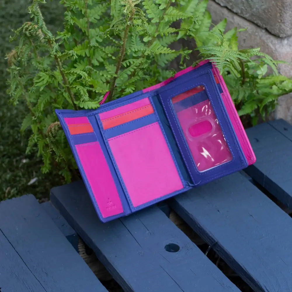 Open view of berry RFID Secure trifold leather purse showing card slots, ID windows, slip pockets, and note sections