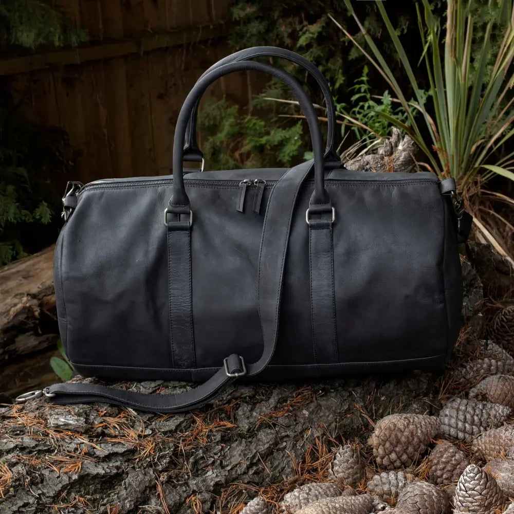 Outdoor display view of the Columbus Black Leather Holdall showcasing its premium leather texture and modern travel style.