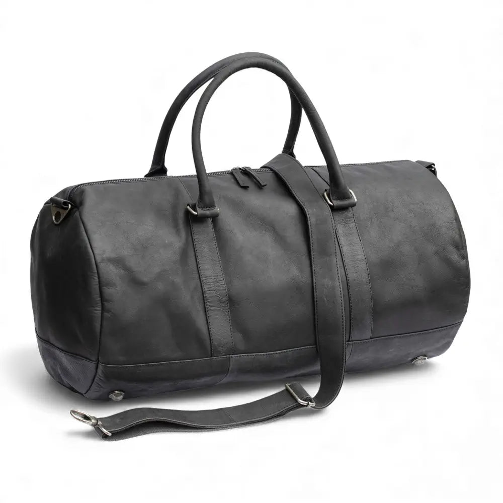Front view of the Columbus Black Leather Holdall showing its sleek cylindrical shape and front zipped pocket.