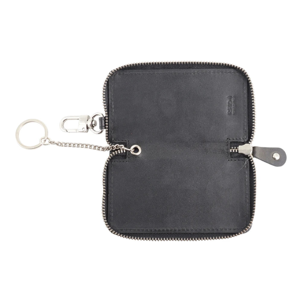 Black leather key case with a keychain on a white background