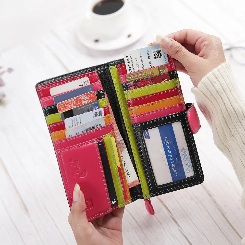 Front view of Black wallet with a pink strap on a white background