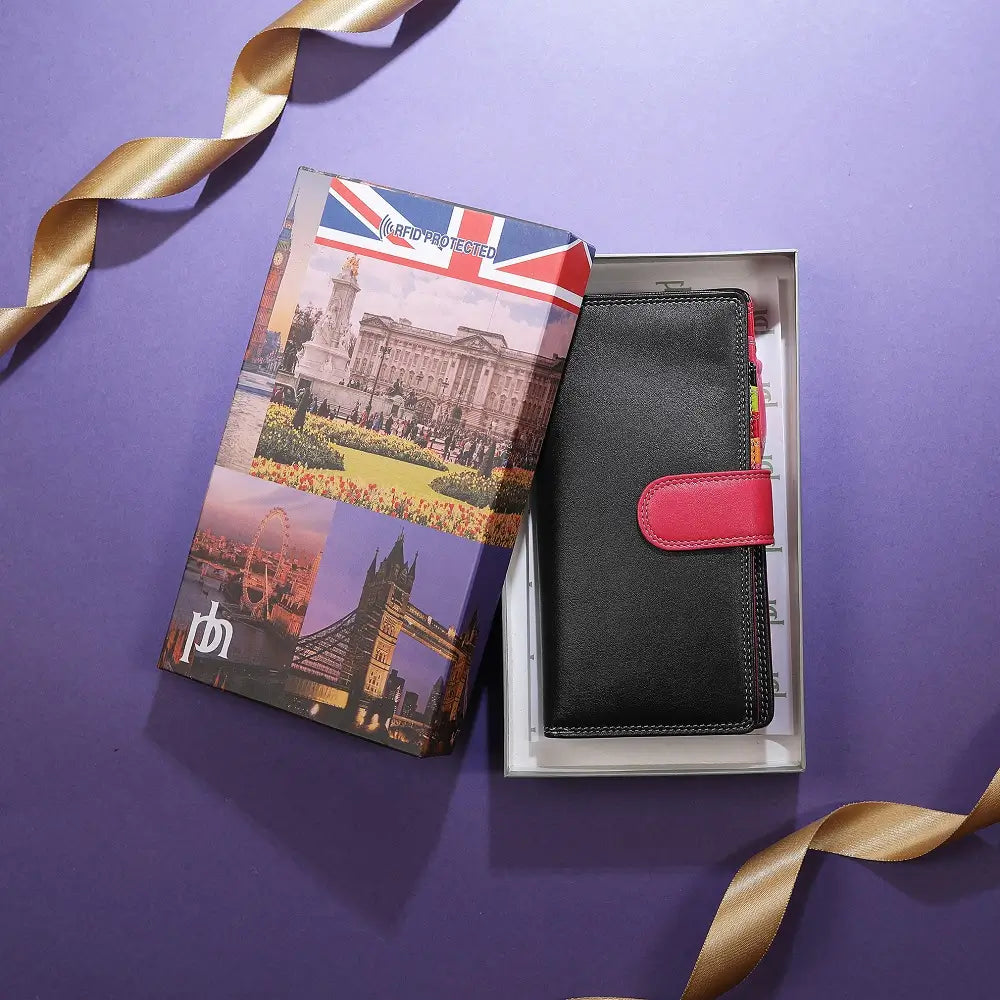 Black wallet travel-themed packaging on a purple background