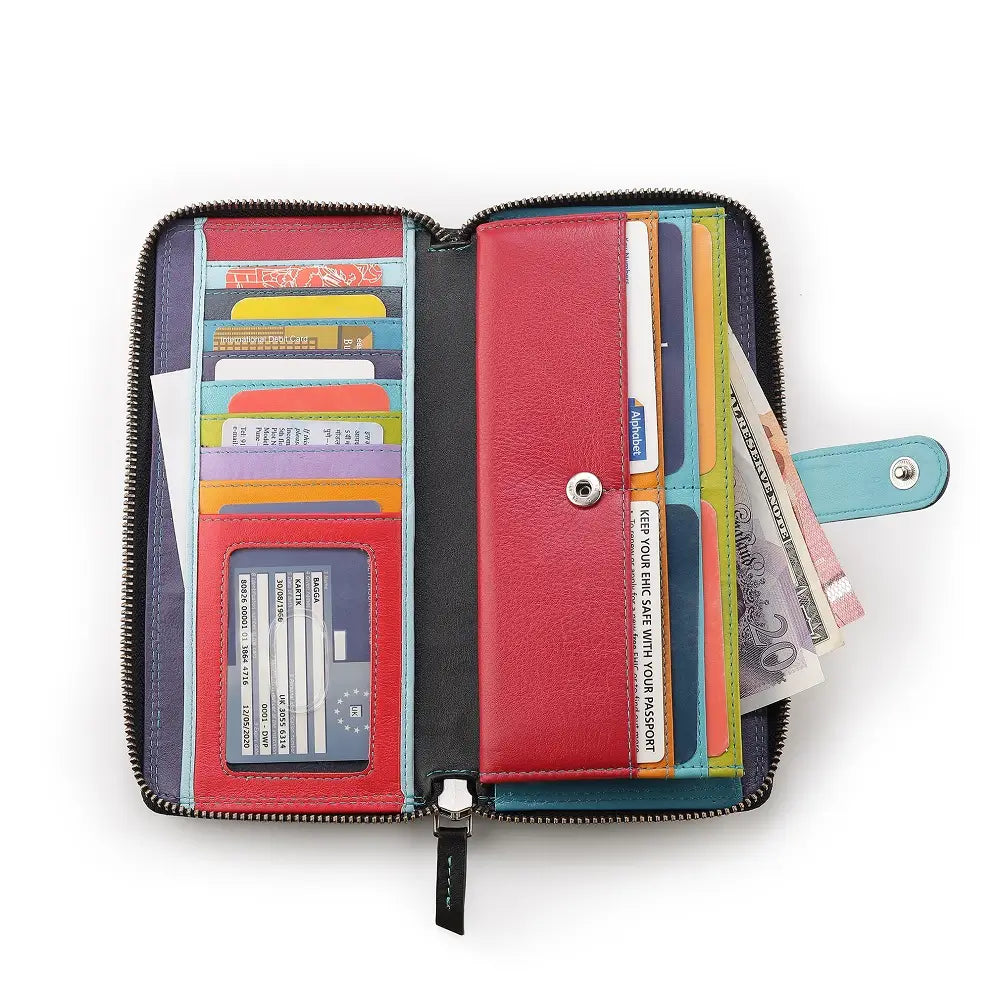 Open black purse with various cards and money on a white background