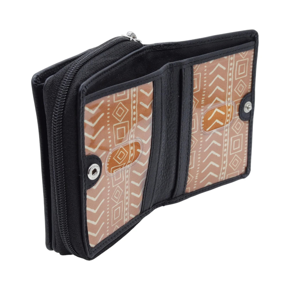 Black purse with tribal patterned flap on a white background