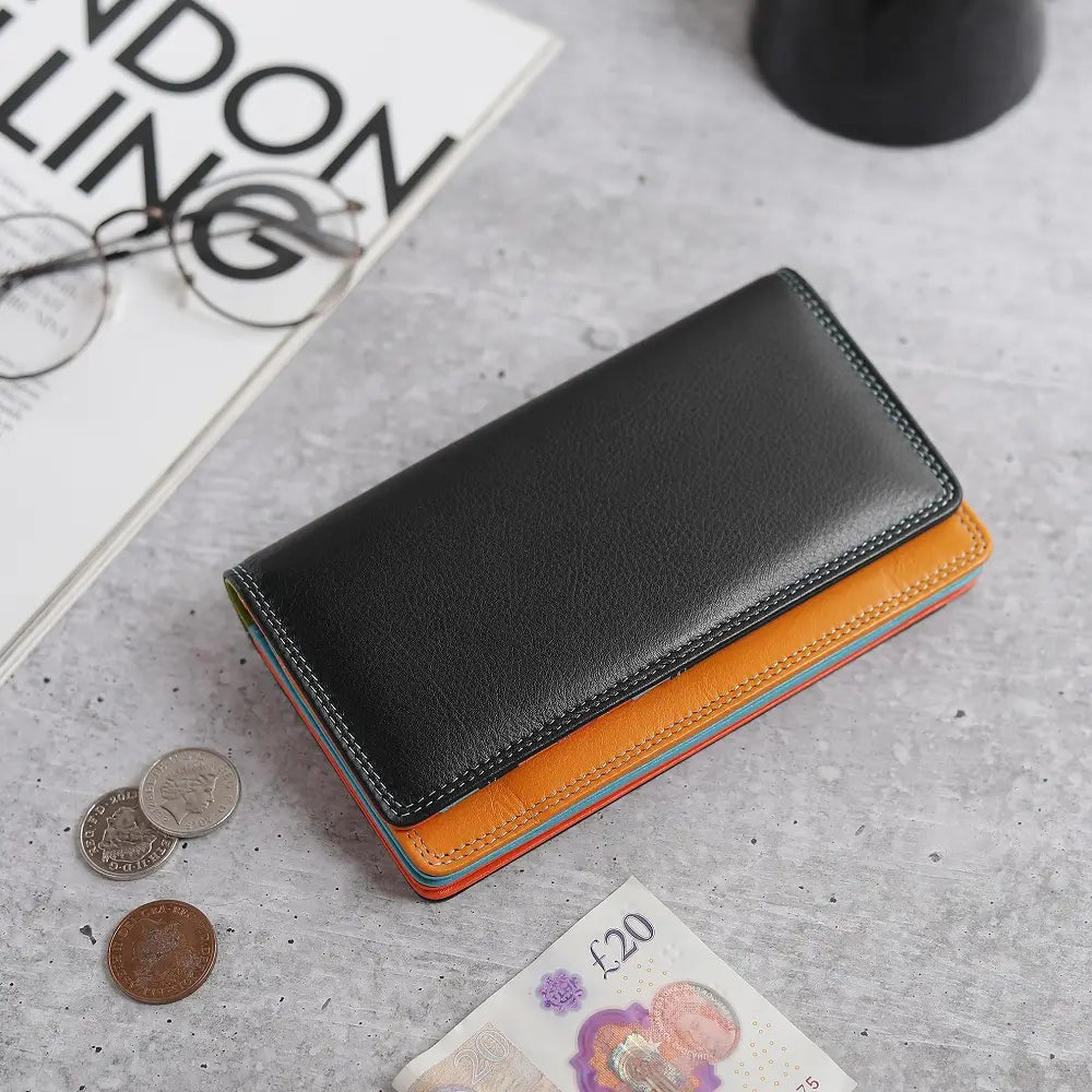Lifestyle view of Black wallet with orange bottom section on a white background