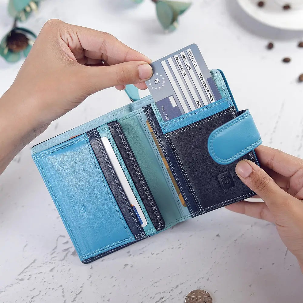 Blue wallet with card slots held open by hands on a light background