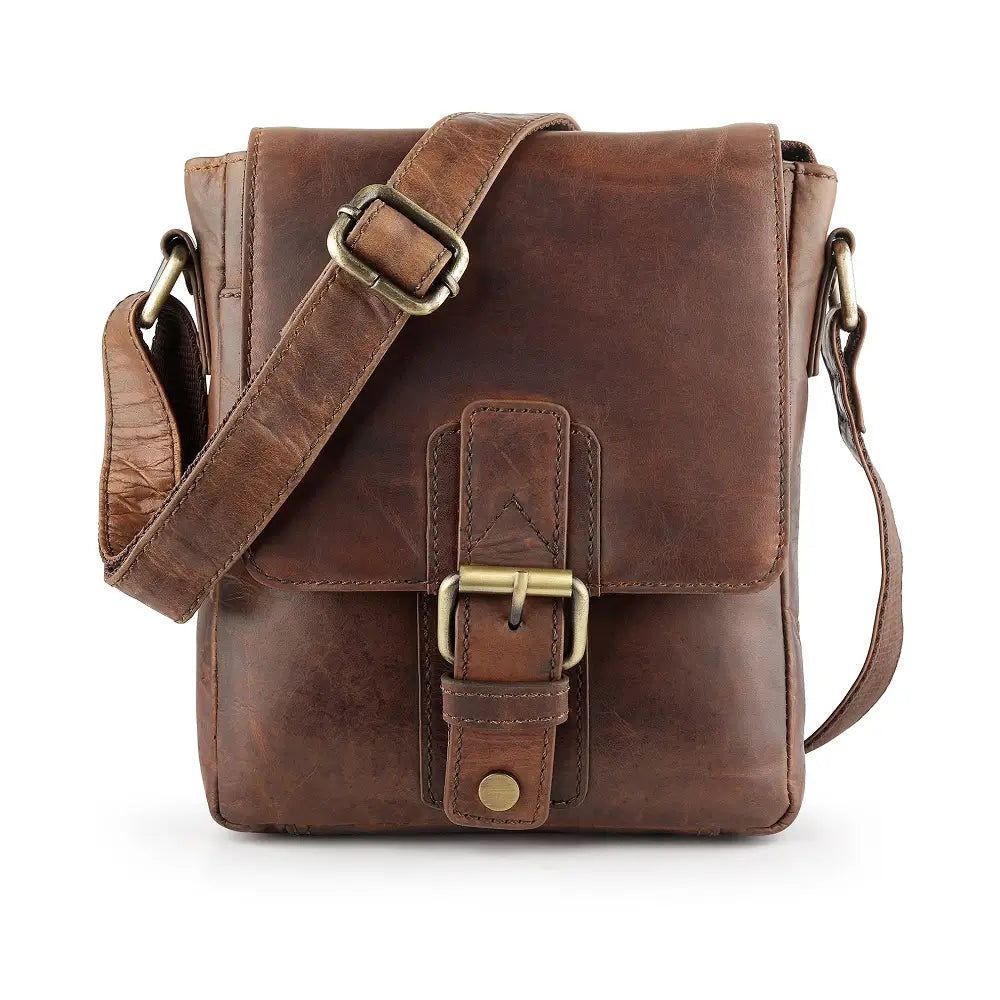 Brown leather crossbody bag with gold buckles on a white background