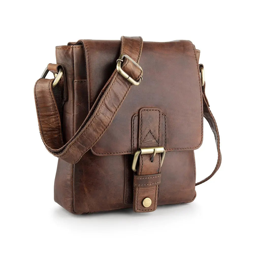 Brown leather crossbody bag with gold buckles on a white background