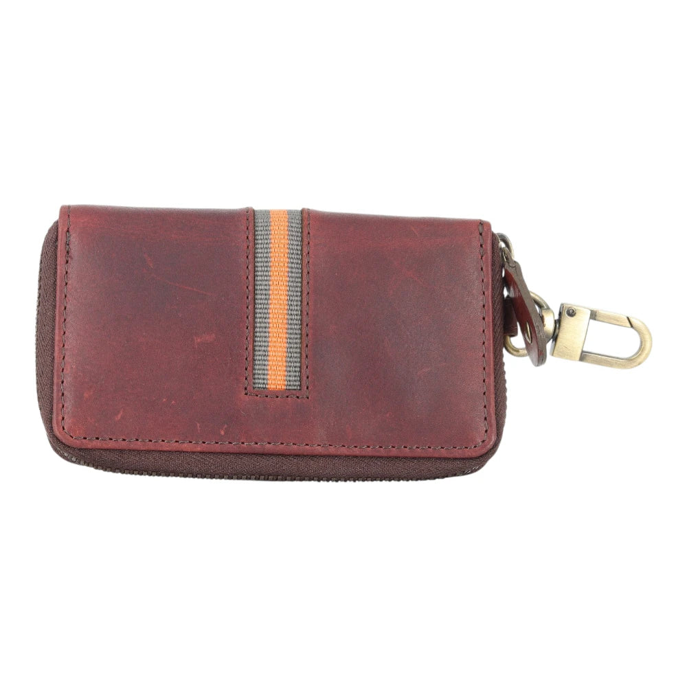 Brown leather key case with a keychain on a white background