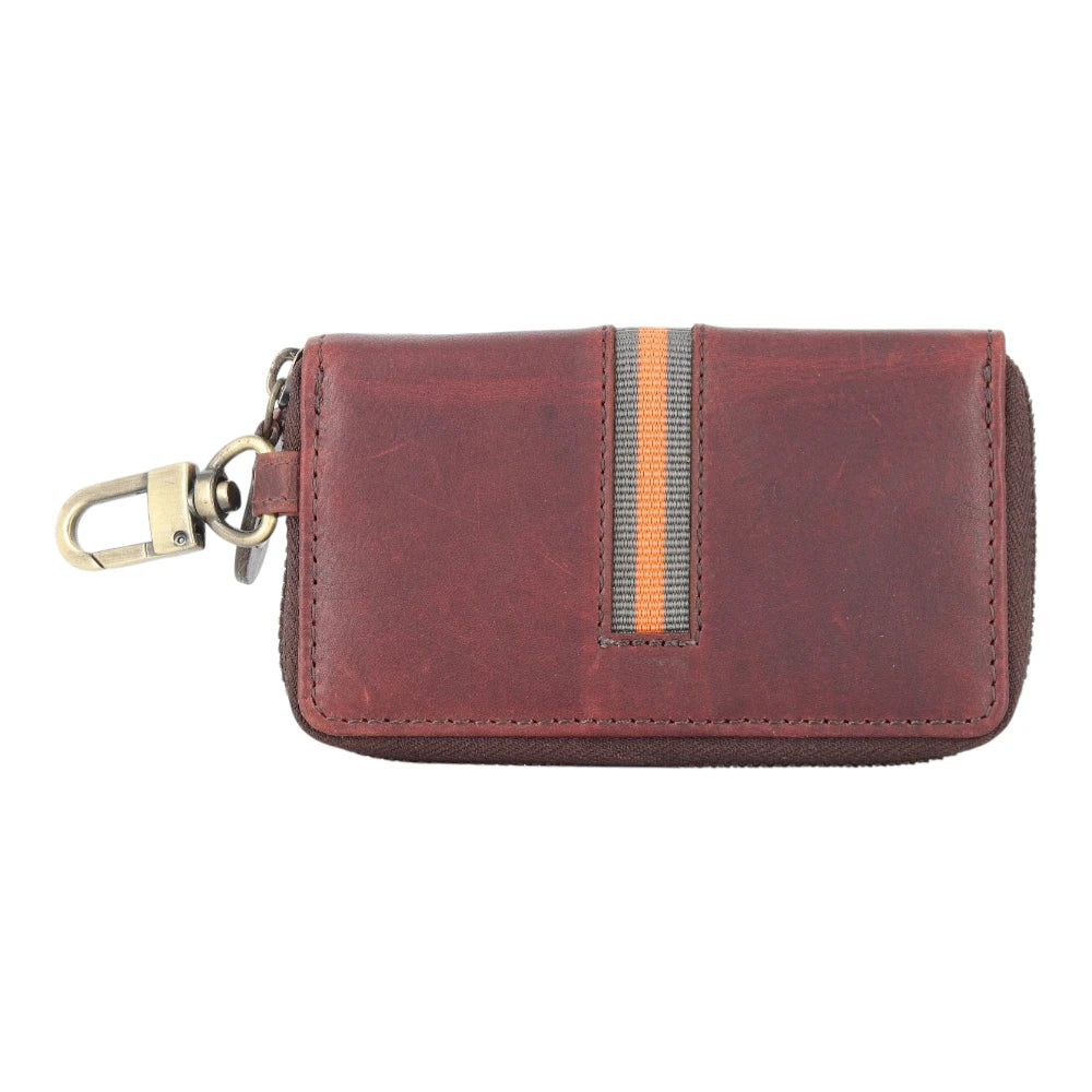 Brown leather keycase  organizer with a keychain on a white background