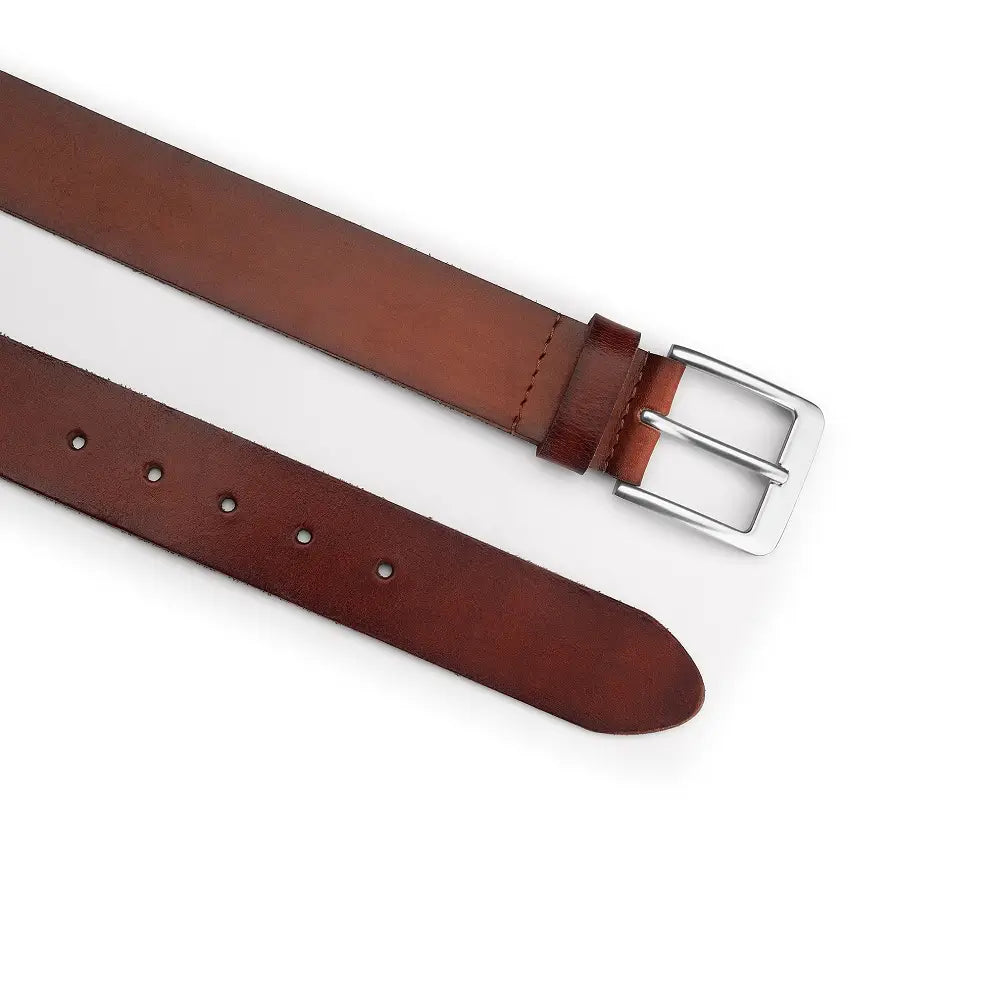 Top angle view of Brown leather belt with a silver buckle on a white background