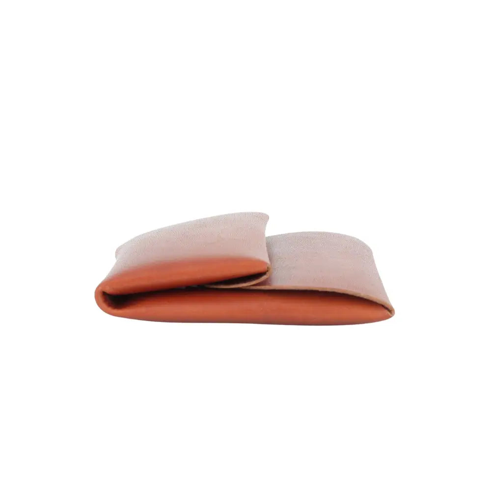 Top side view of Brown Leather coin pouch on a white background