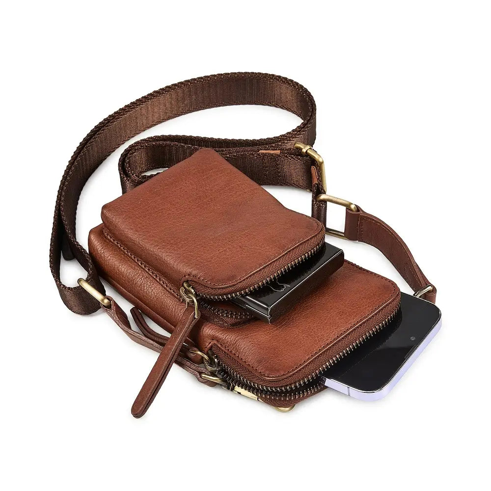 Brown leather phone bag with a phone inside on a white background