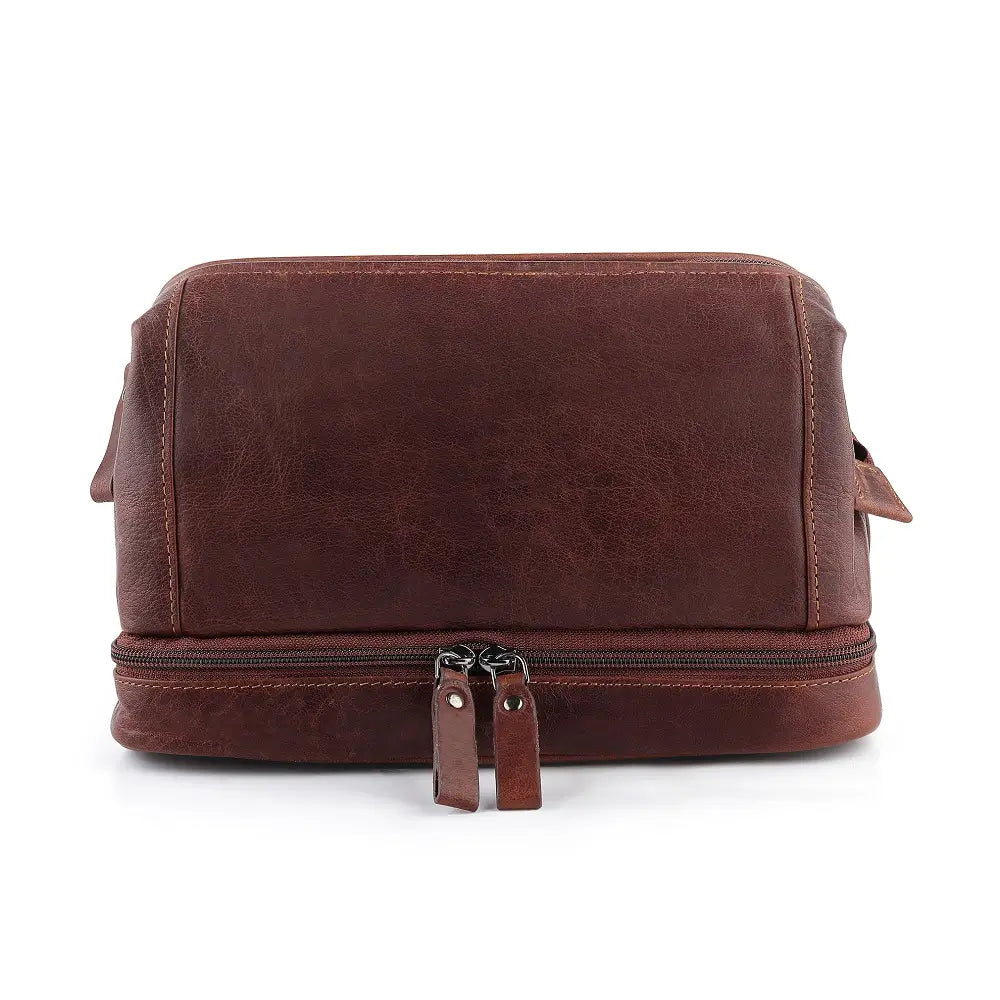 Brown leather toiletry bag with zipper on a white background