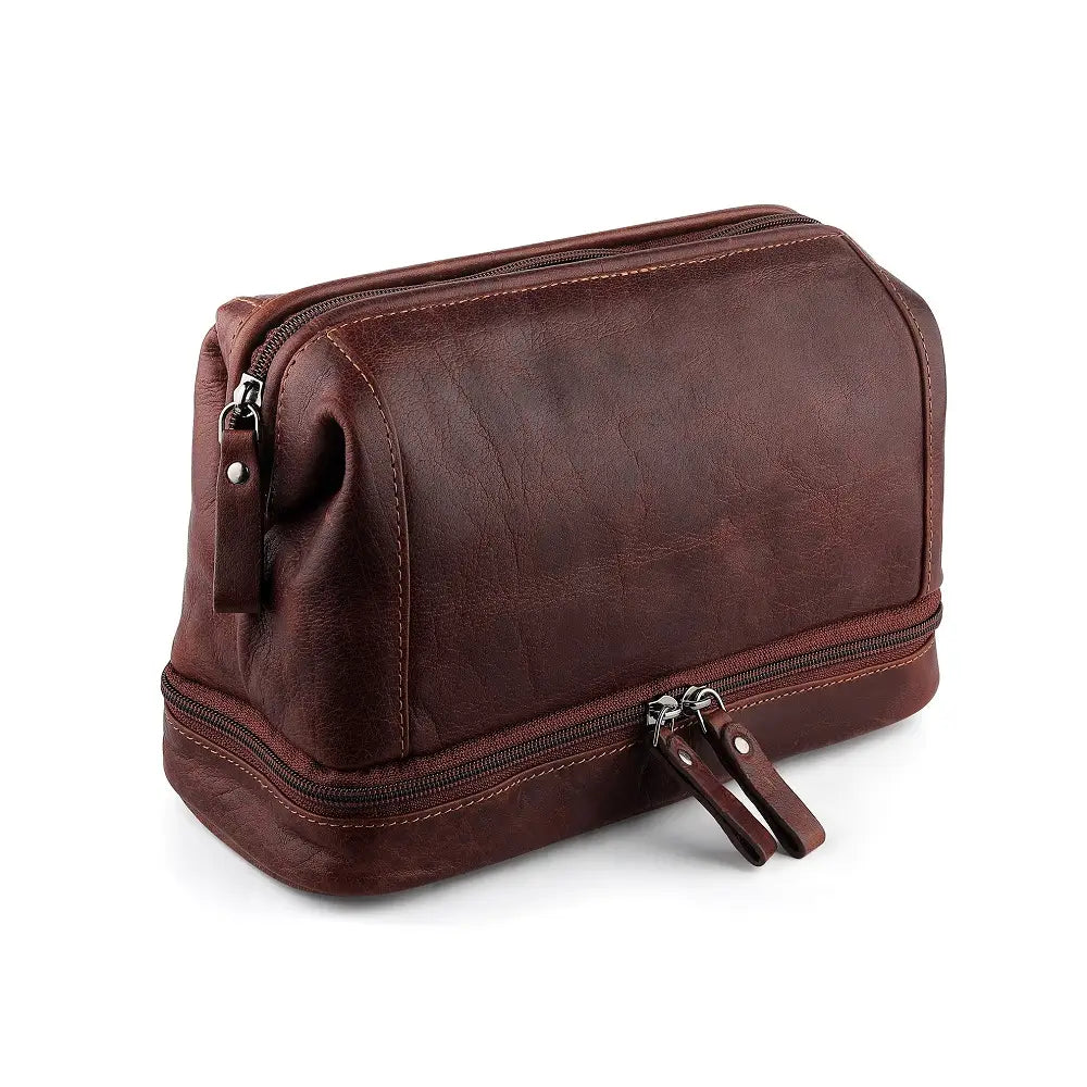 Brown leather toiletry bag with zipper on a white background