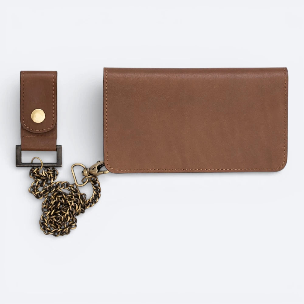 Brown leather wallet with chain and strap on a white background