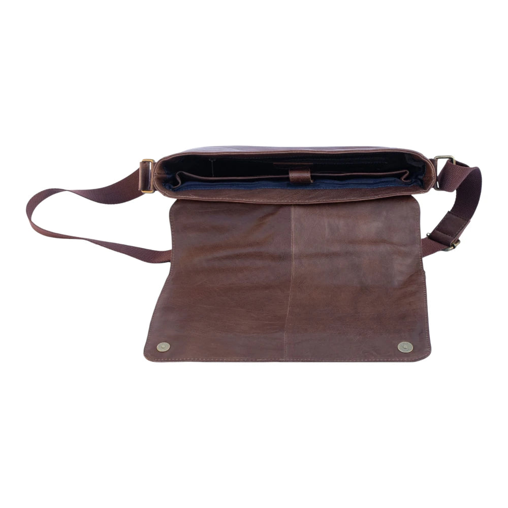 Brown leather bag with a strap on a white background