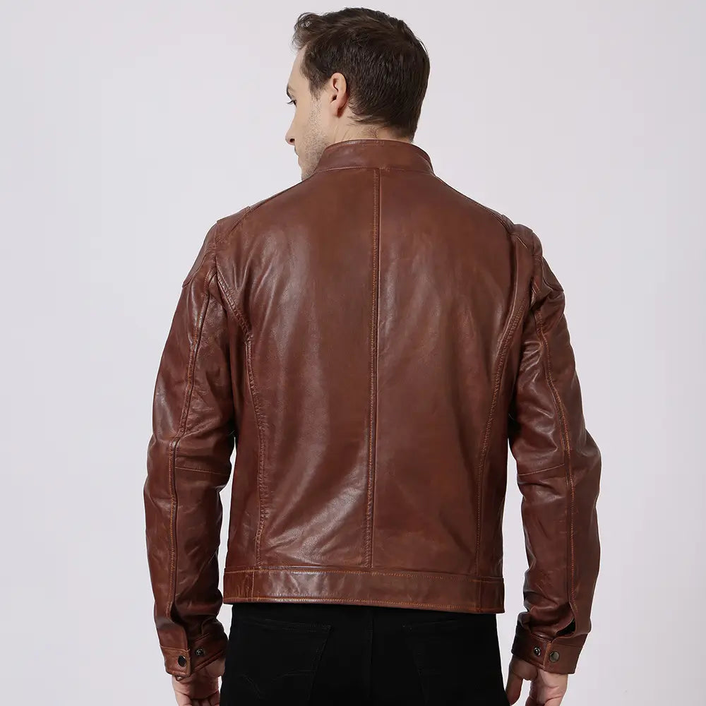 Man wearing a cognac leather jacket on a white background