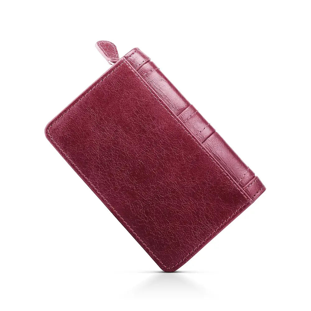 Maroon leather purse on a white background