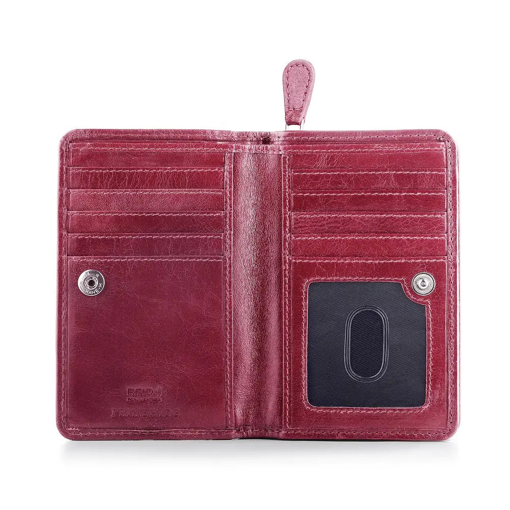 Maroon leather purse with card slots and a coin pocket on a white background