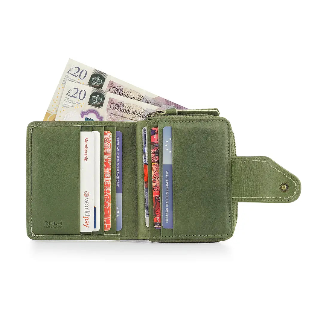 Green wallet with cards and money on a white background