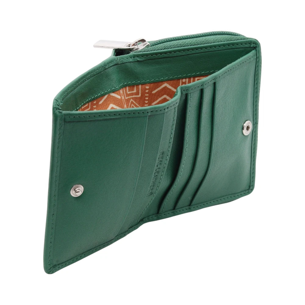 Green purse with a patterned interior on a white background