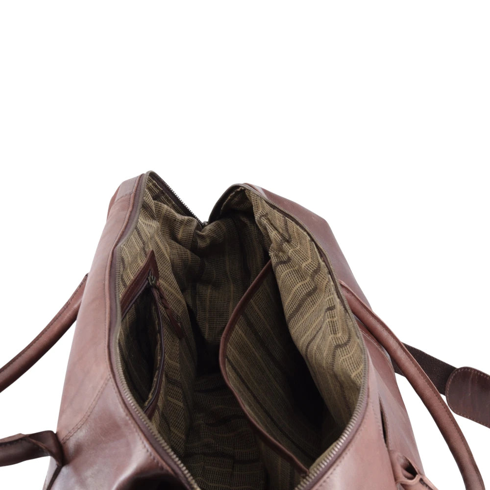 Brown leather bag with open front pocket on a white background