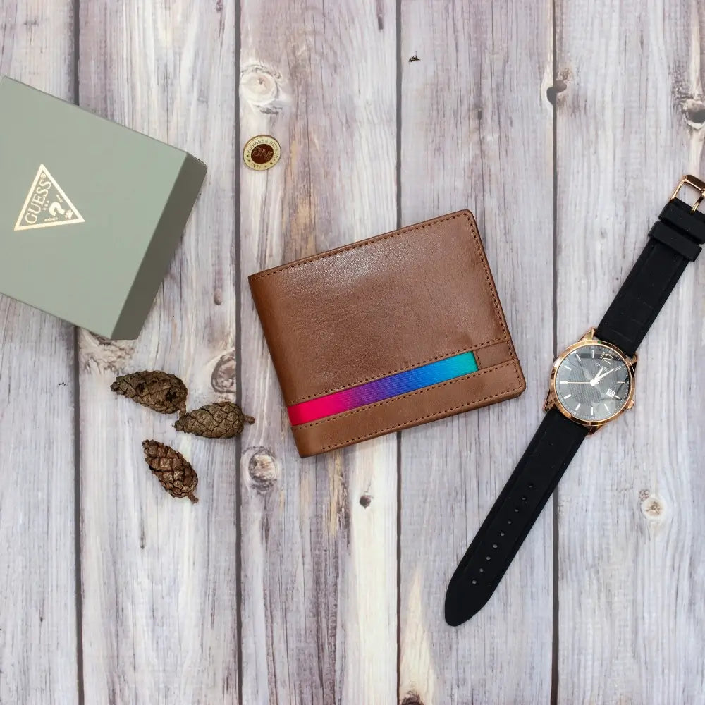 Brown wallet with colorful stripes and black watch on a wooden surface