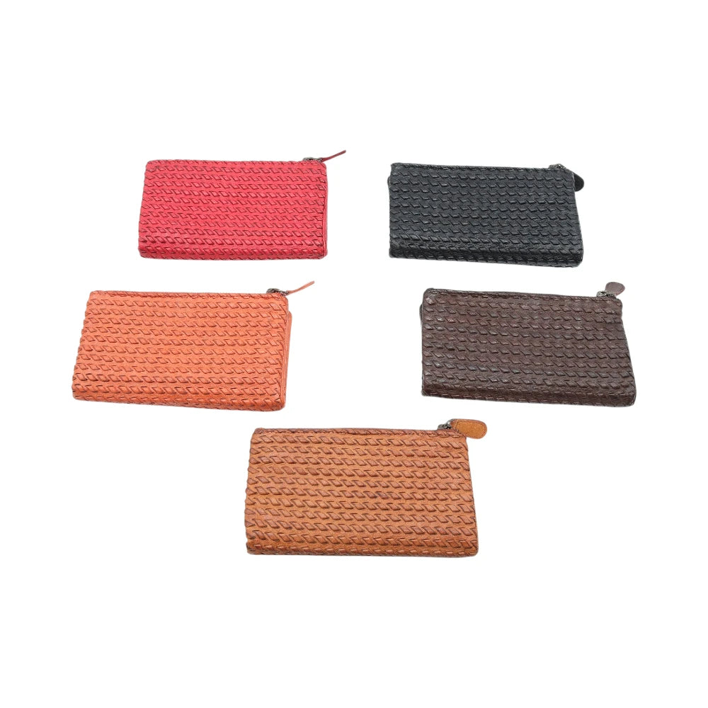 Five leather purses in different colors on a white background