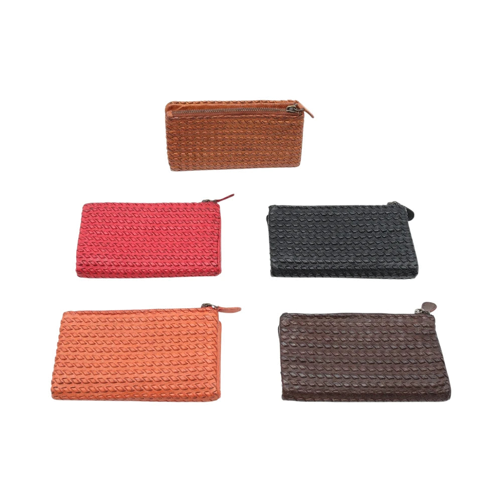 Five leather purses  in different colors on a white background