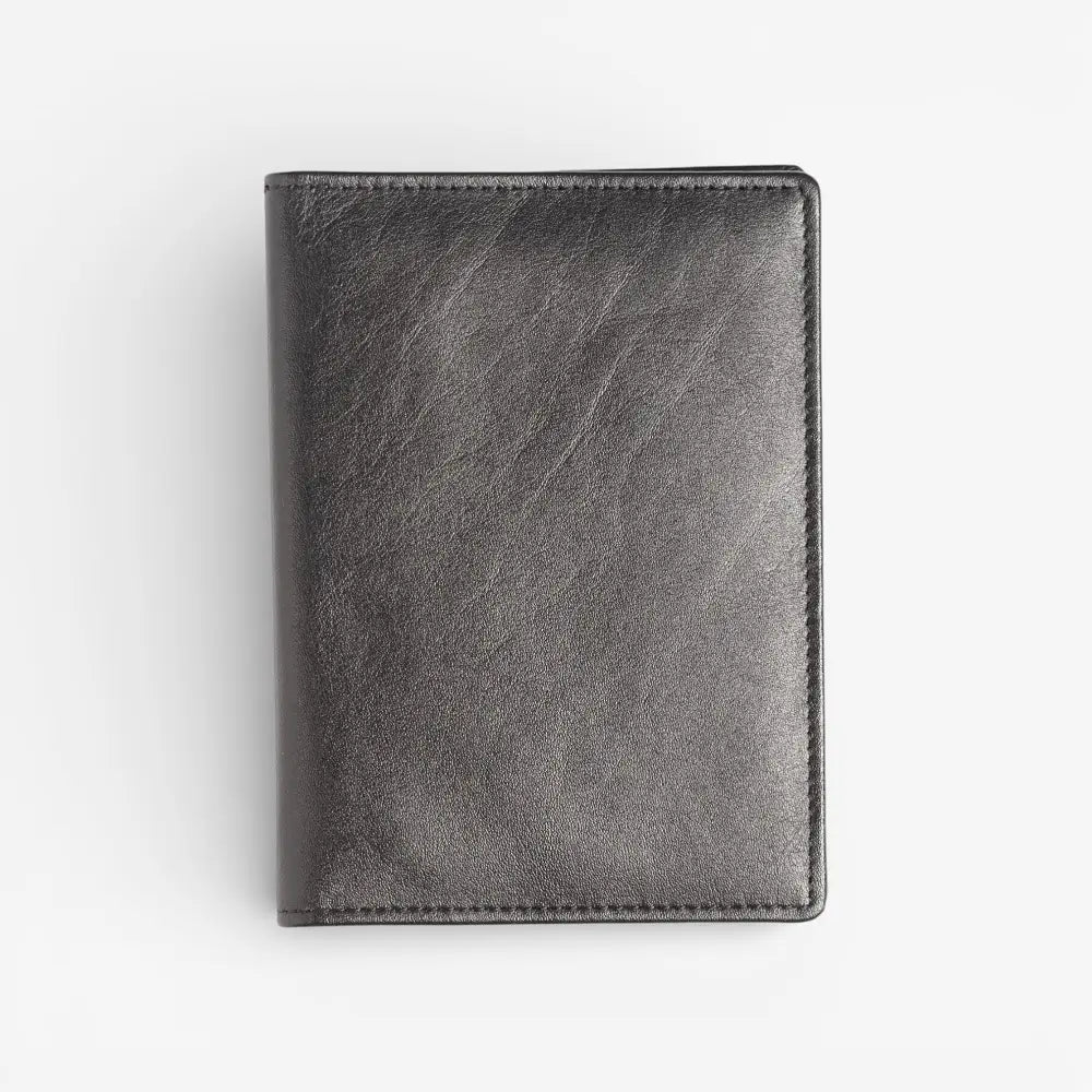 Black leather wallet on a light gray background