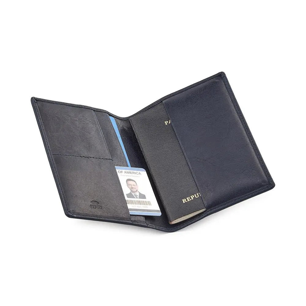 Navy leather passport holder with a passport and ID card on a white background