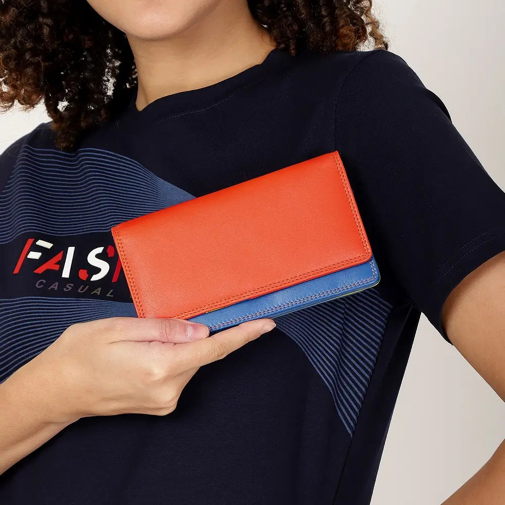 Person holding Orange wallet with blue bottom section on a white background