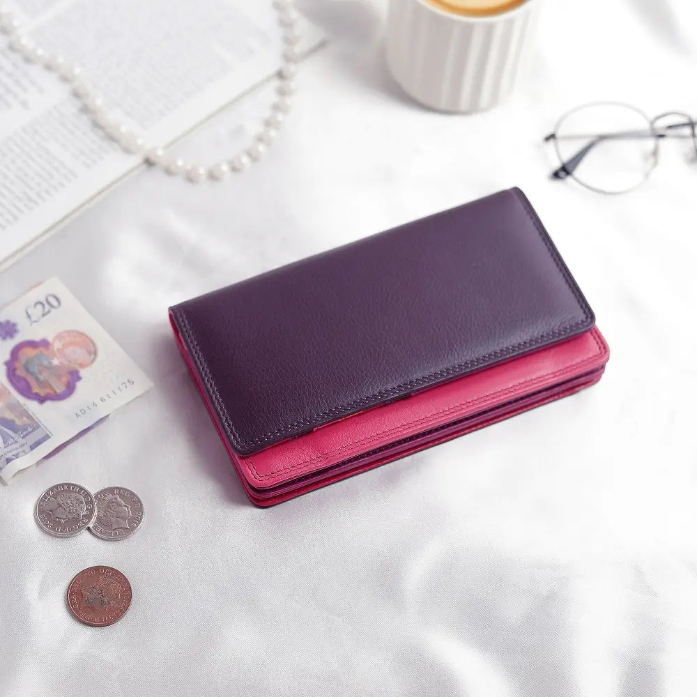 Lifestyle view of Purple wallet with pink bottom section on a white background