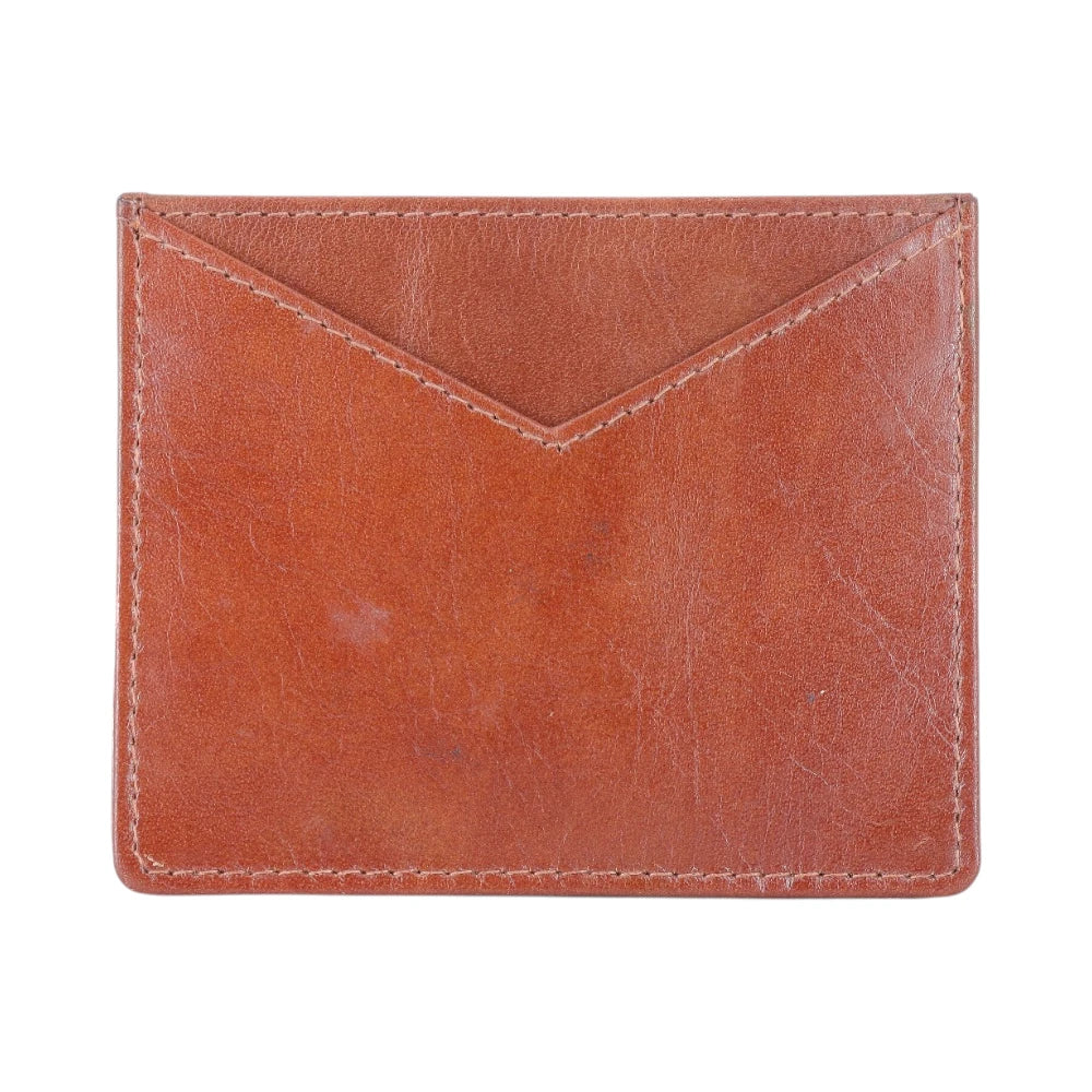 Brown leather cardholder with a visible credit card on a white background