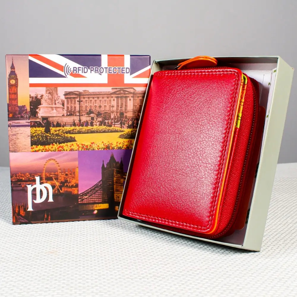 Red wallet in a box featuring British landmarks