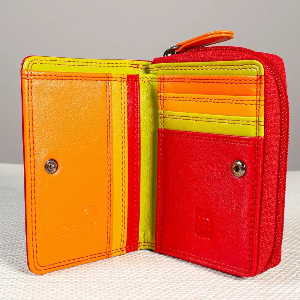 Red wallet with orange, yellow, and red sections on a textured surface.