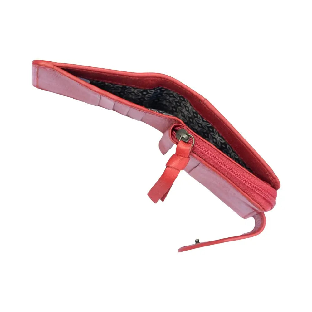 Red leather purse with a zipper on a white background