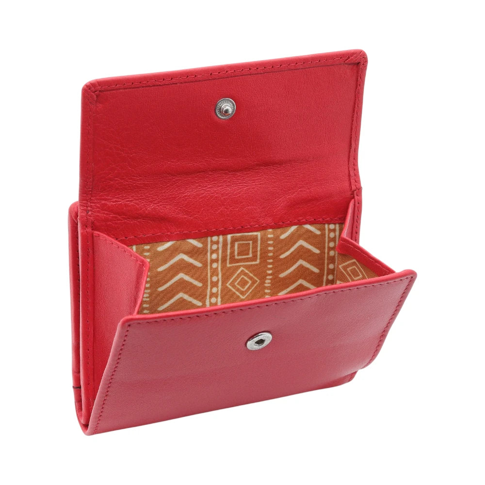 Red purse with a patterned interior on a white background