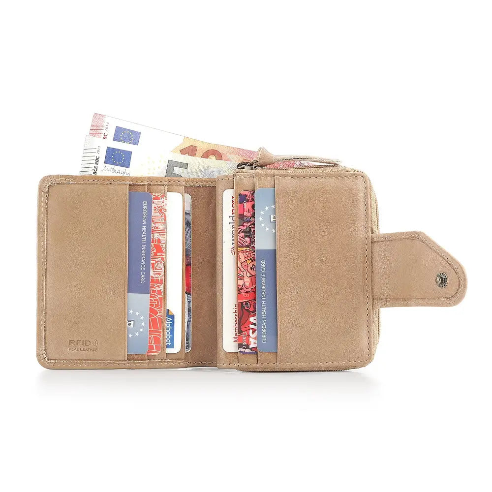 sand wallet with cards and money on a white background
