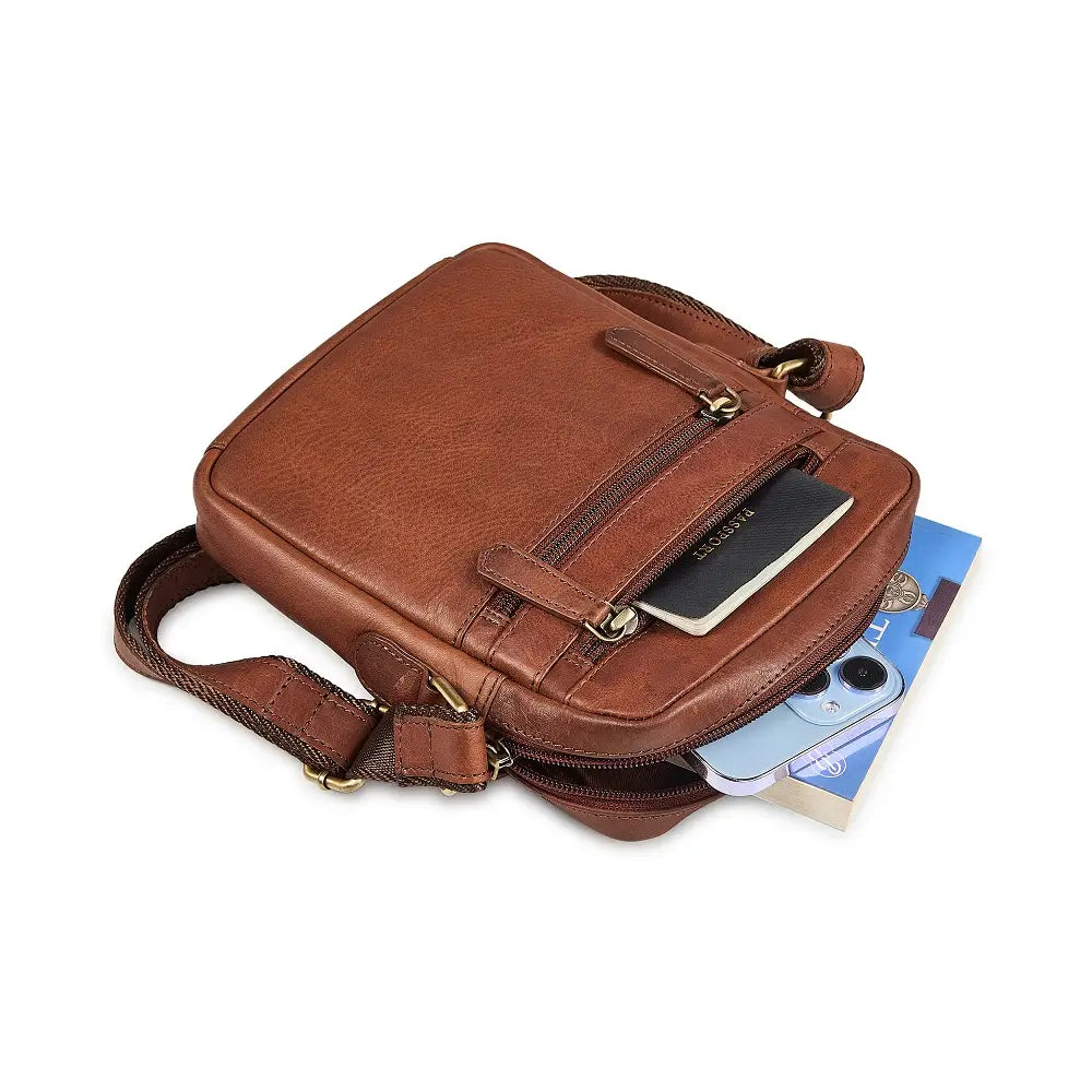 Brown leather crossbody bag on a white background