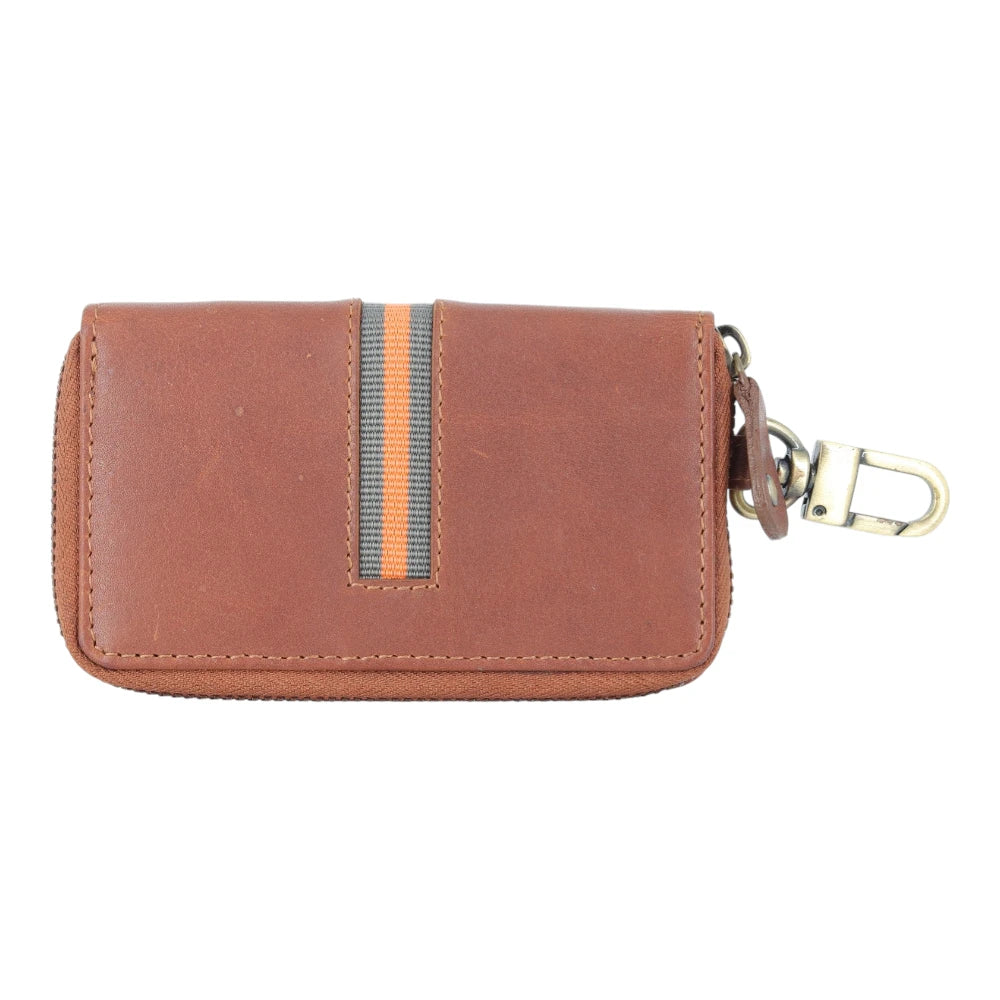 Tan leather key case with a keychain on a white background
